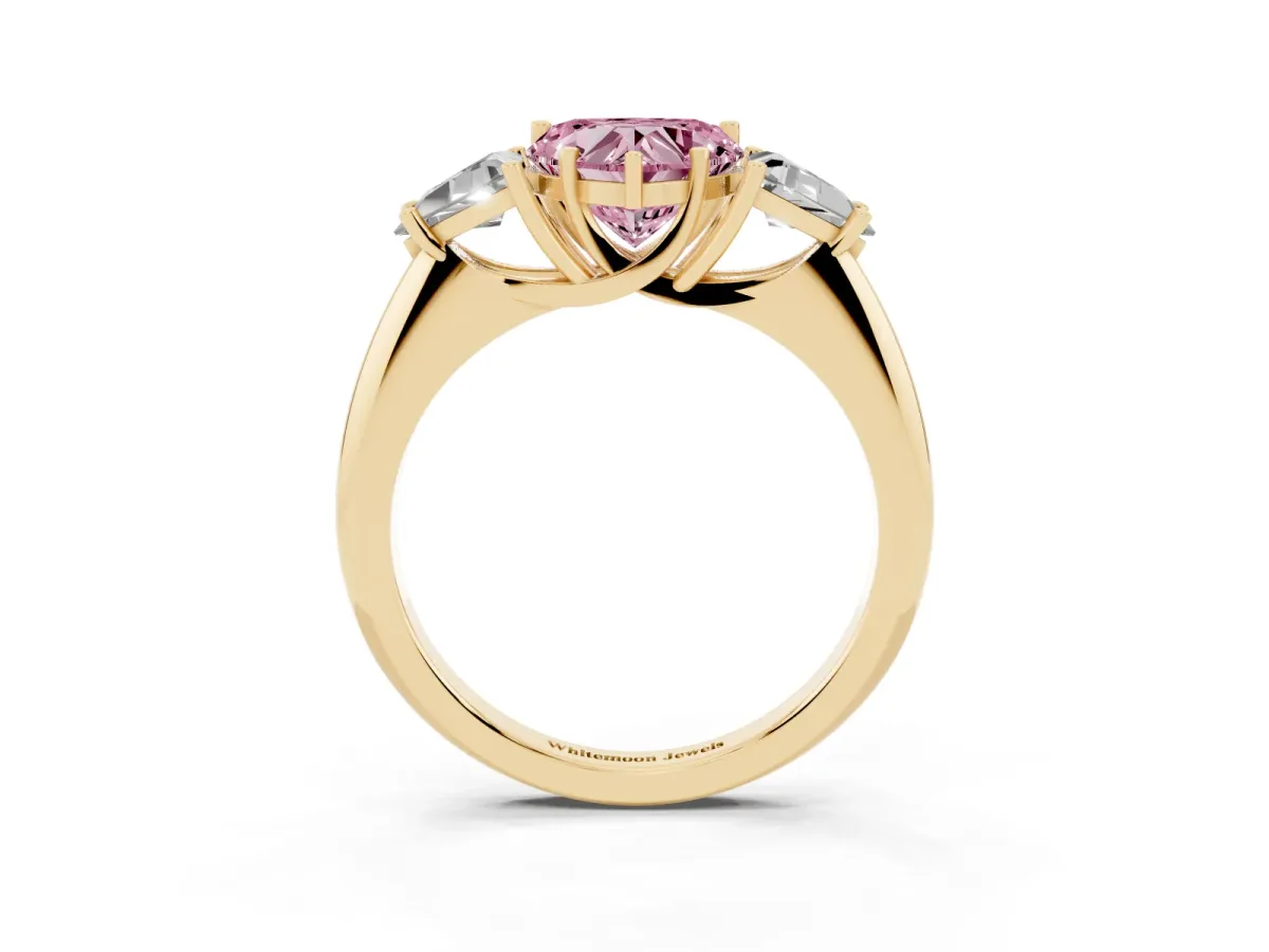Fancy Pink Three-Stone Heart Cut Diamond Engagement Ring with Trillion Side Stones and Prong Setting Yellow gold