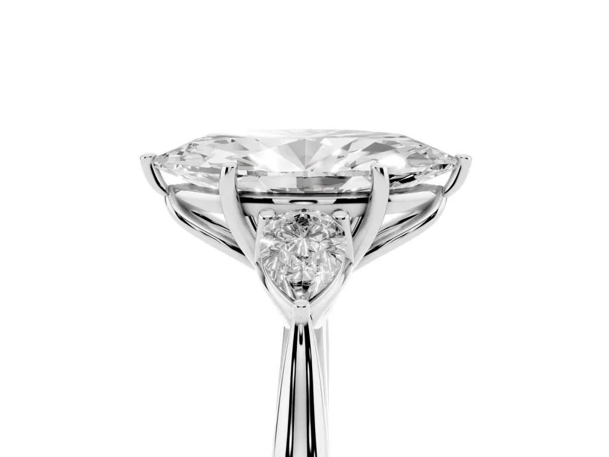 Three-Stone Marquise Cut Diamond Ring with Pear Side Stones in Four-Prong Setting Platinum