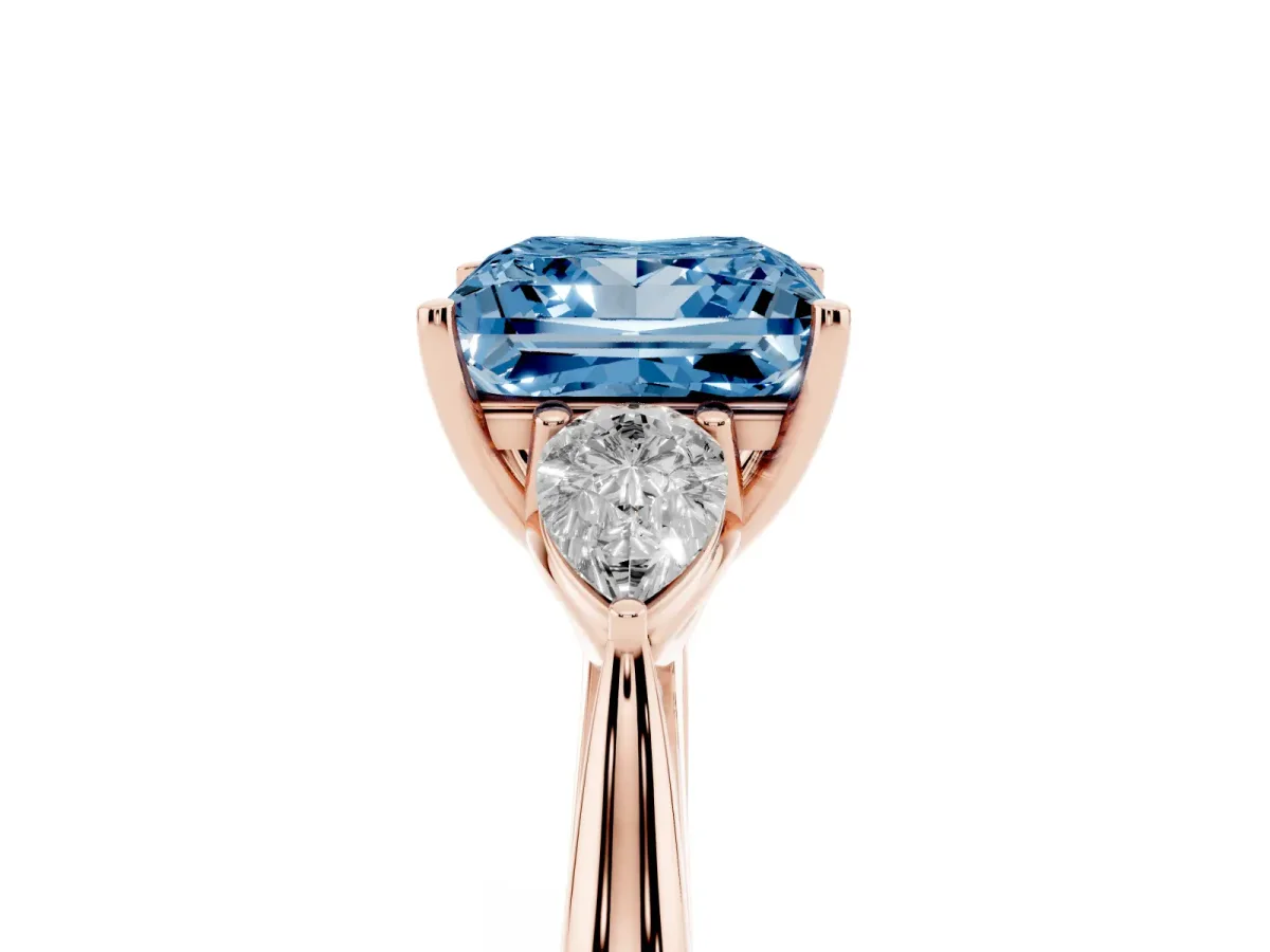 Fancy Blue Princess Cut Diamond Three-Stone Ring with Pear Side Stones and Prong Setting Rose gold