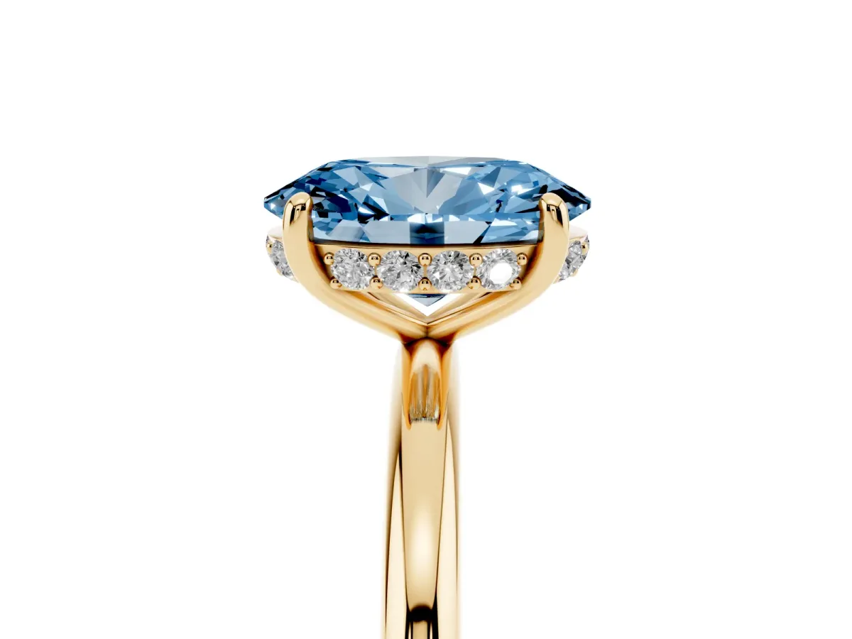 Fancy Blue Oval Cut Solitaire Diamond Ring with a Classic Band and Four-Prong Setting Yellow gold