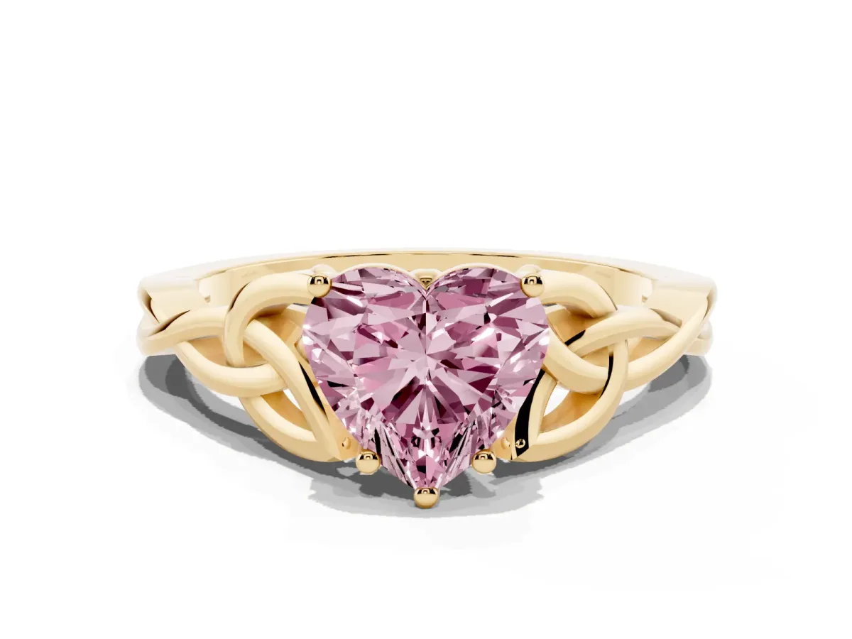 Fancy Pink Heart Cut Diamond Solitaire Engagement Ring with Celtic Knot Band and Four-Prong Setting Yellow gold