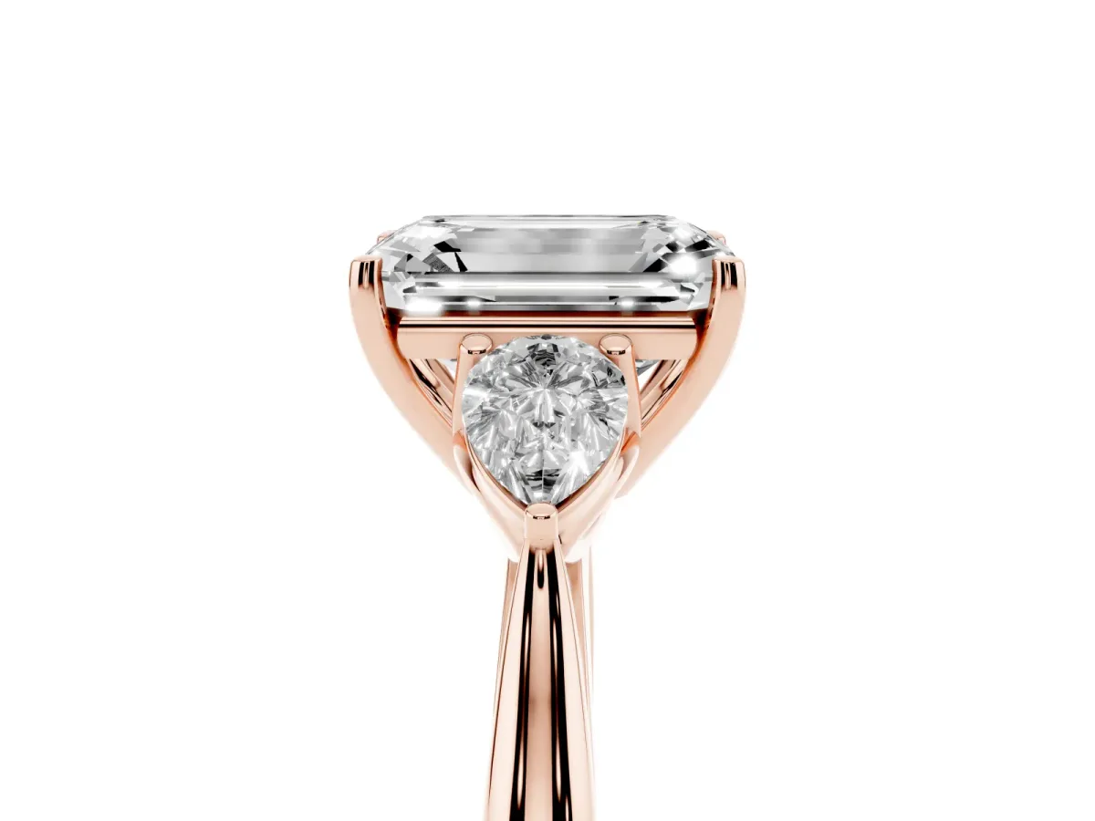 Emerald Cut Diamond Three-Stone Ring with Pear Side Stones and Prong Setting Rose gold