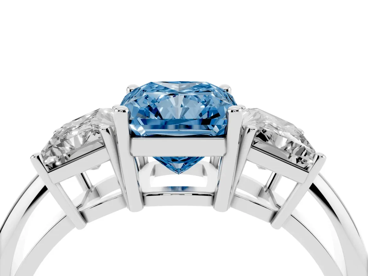 Fancy Blue Three-Stone Radiant Cut Cut Diamond Engagement Ring with Prong Setting on a White Gold Band Silver
