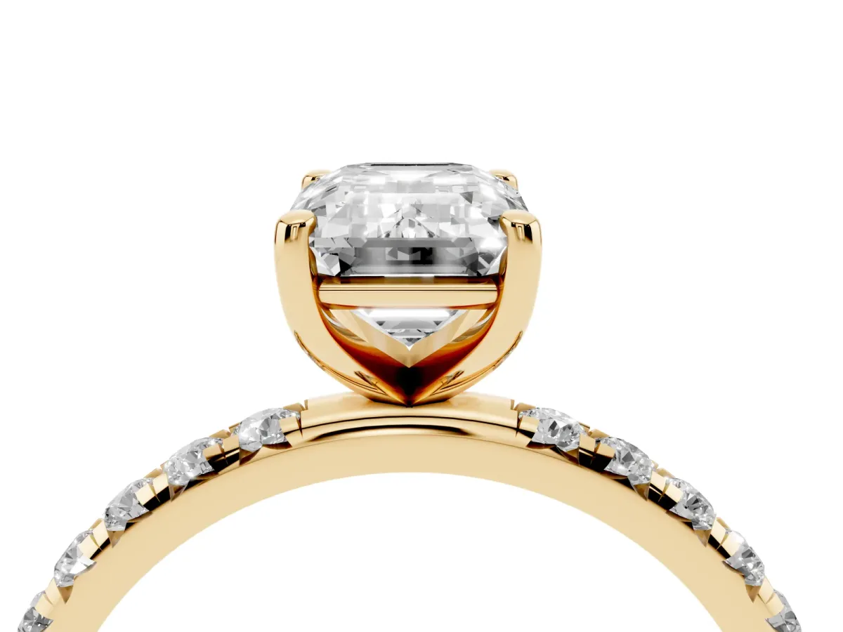 Emerald Cut Cut Diamond Solitaire Ring with Micro Pave Band and Four Prong Setting Yellow gold
