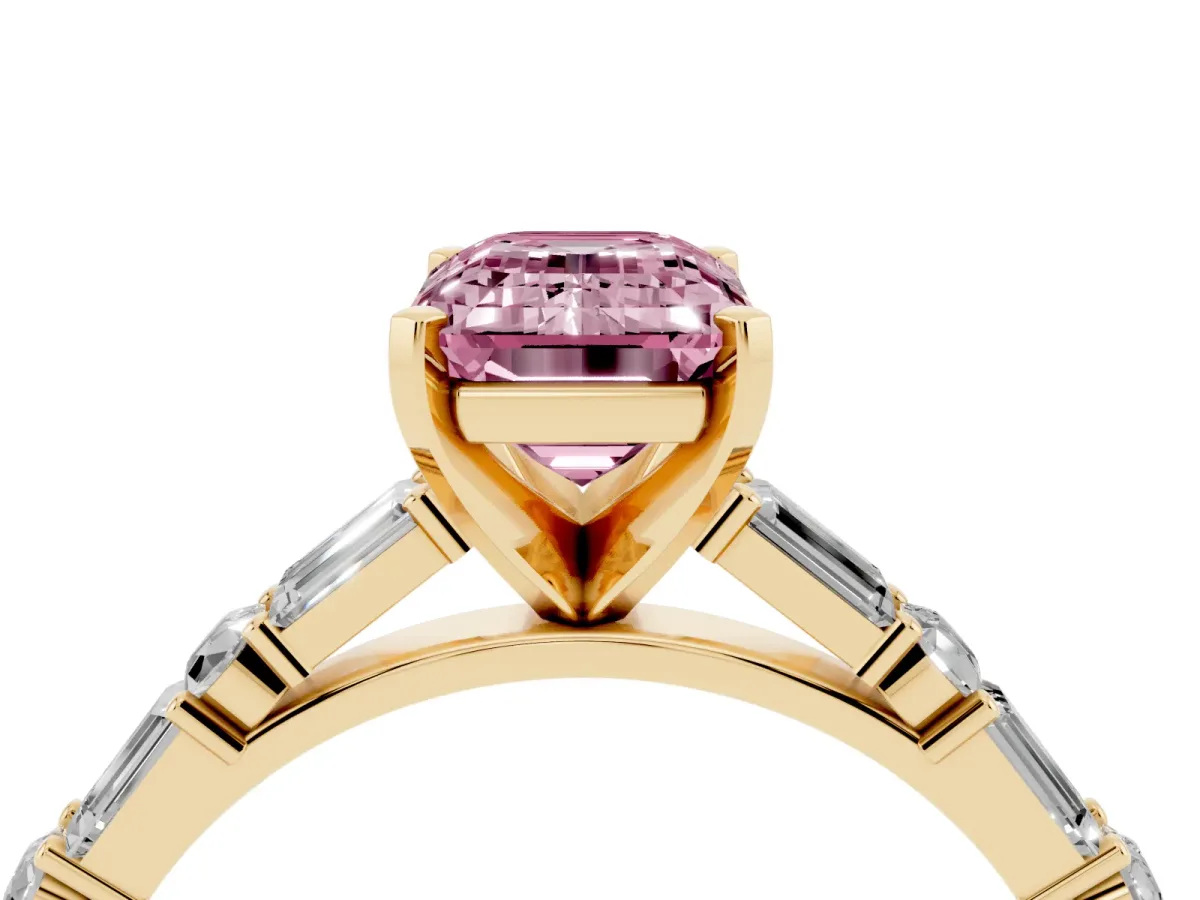 Fancy Pink Emerald Cut Diamond Solitaire with Side Baguettes and Channel Set Band Yellow gold