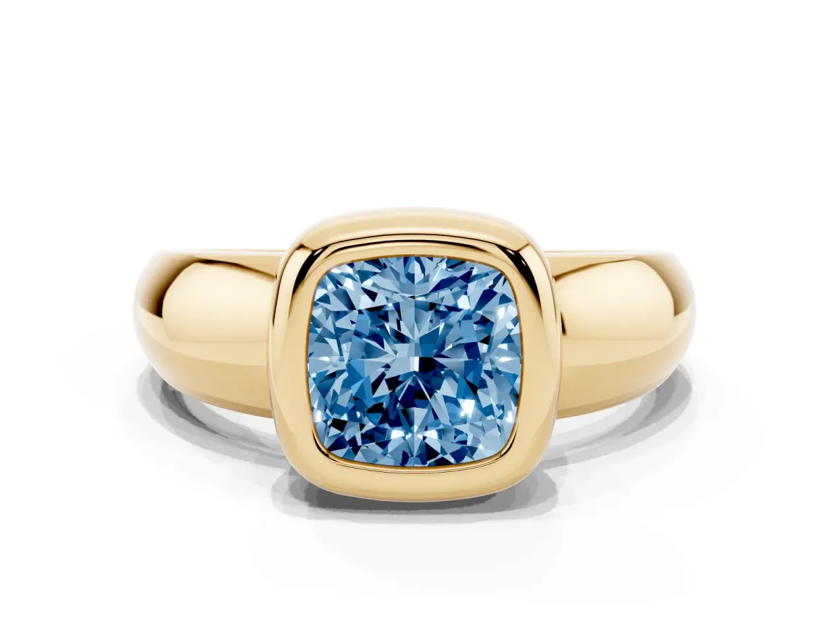 Fancy Blue Bezel Set Cushion Cut Solitaire Ring with Wide Band Yellow gold