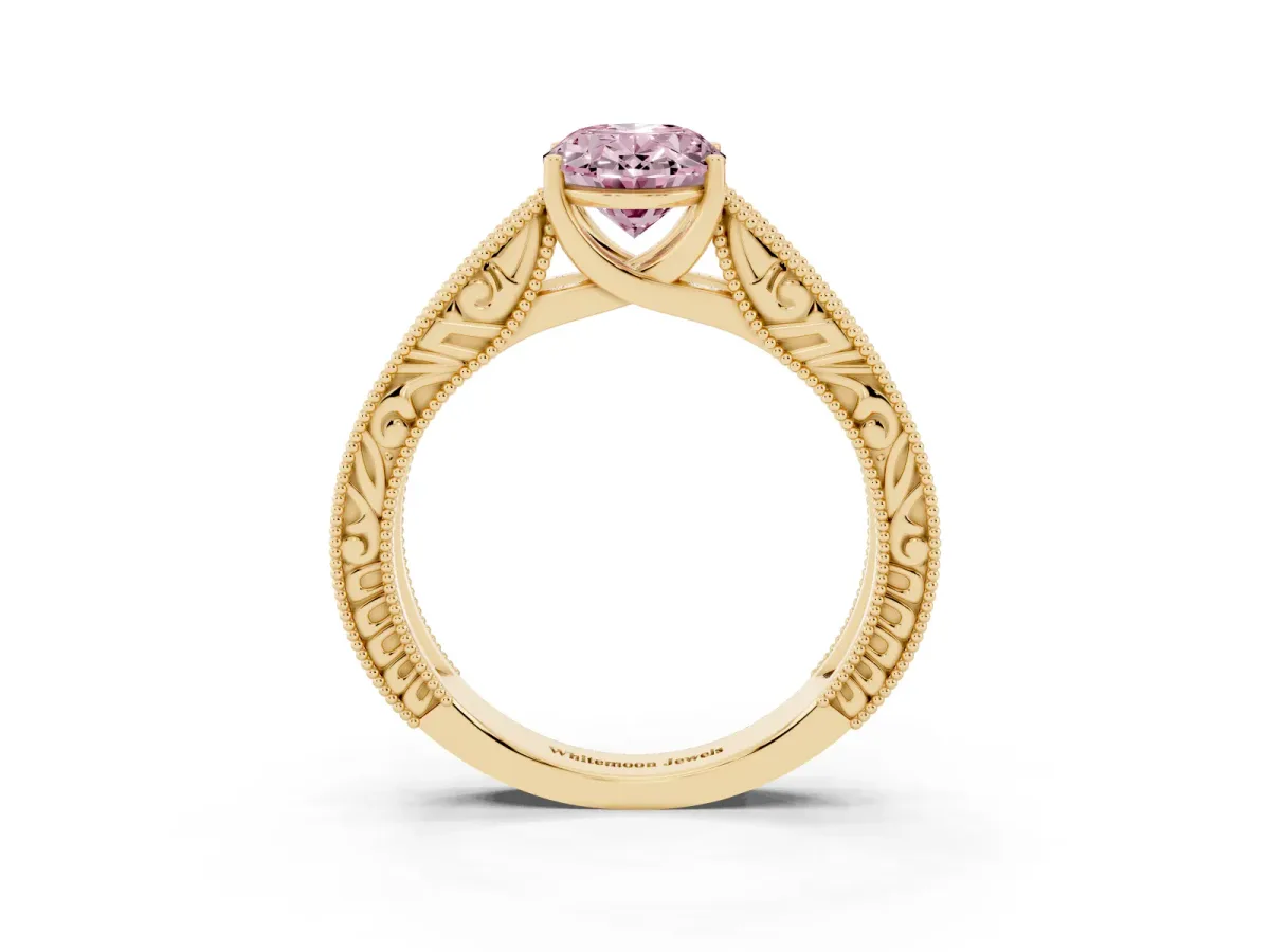 Fancy Pink Oval Cut Diamond Solitaire Ring with Engraved Band and Four-Prong Setting Yellow gold