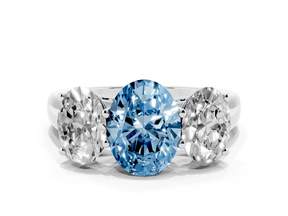 Fancy Blue Oval Cut Three-Stone Diamond Ring with Prong Setting on a Classic Band Platinum