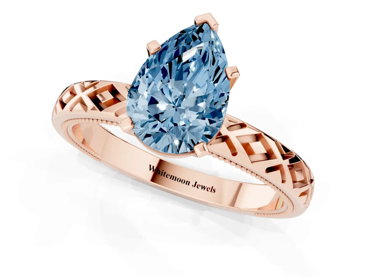 Fancy Blue Pear Cut Solitaire Diamond Ring with Milgrain and Black Enamel X Pattern Band Rose gold