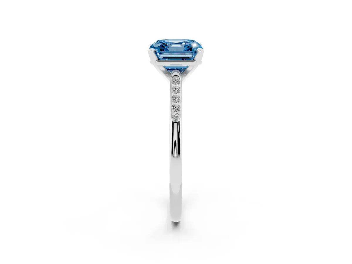 Fancy Blue Asscher Cut Diamond Solitaire Ring with Channel Set Round Band and Prong Setting Silver