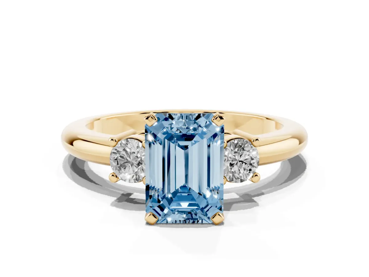 Fancy Blue Three-Stone Emerald Cut Cut Diamond Solitaire with Prong Setting and Classic Band Yellow gold