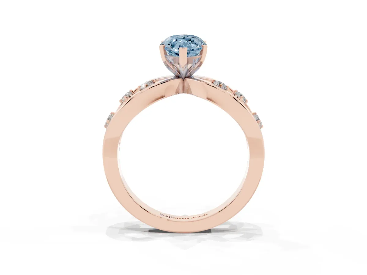Fancy Blue Marquise Cut Cut Solitaire Diamond with Side Stones on Criss-Cross Band and Four-Prong Setting Rose gold