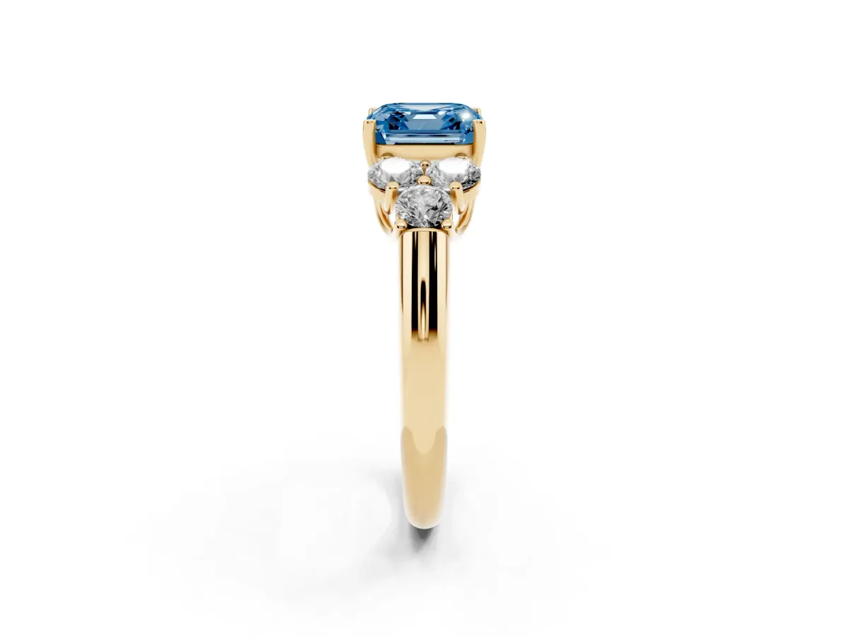 Fancy Blue Asscher Cut Cut Diamond Cluster Ring with Round Accent Stones and Prong Setting on a Classic Band Yellow gold