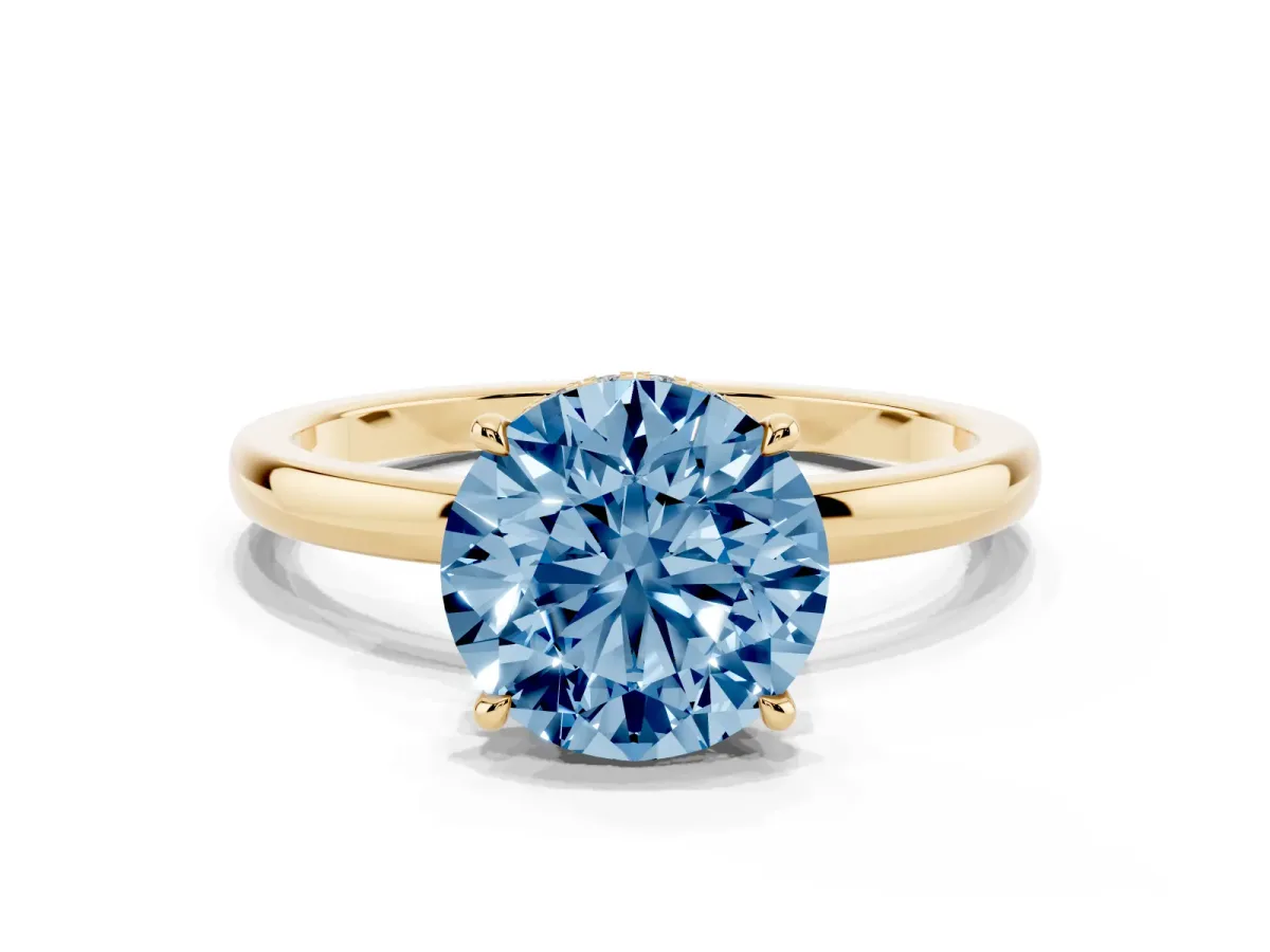 Fancy Blue Round Cut Solitaire Engagement Ring with Cathedral Band and Four-Prong Setting Yellow gold