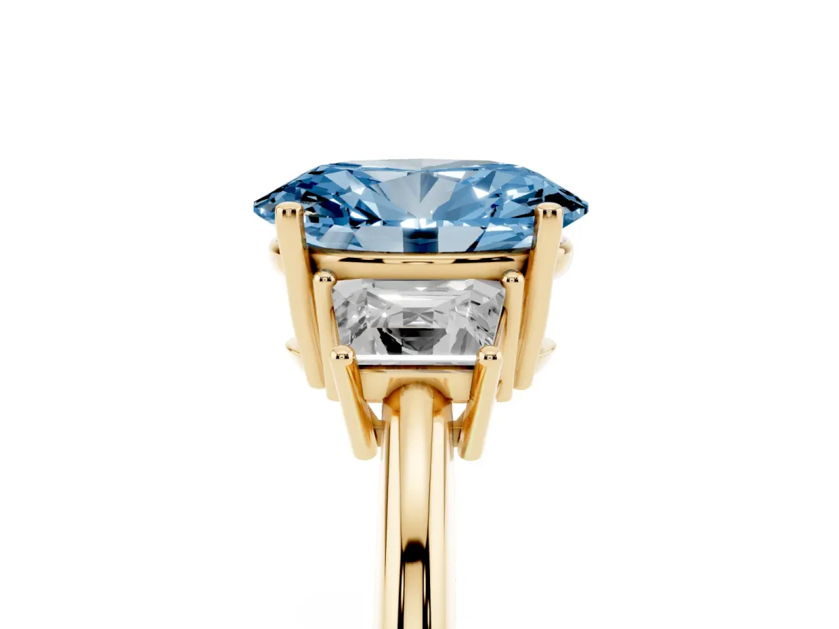 Fancy Blue Oval Cut Diamond Three-Stone Ring with Trapezoid Side Stones and Prong Setting Yellow gold