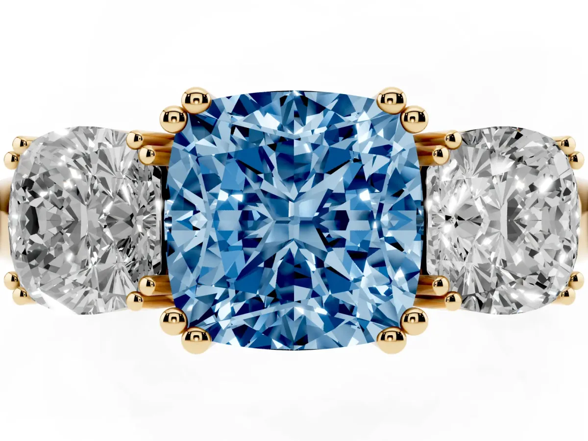 Fancy Blue Three-Stone Cushion Cut Cut Diamond Ring with Channel Set Band and Four-Prong Setting Yellow gold