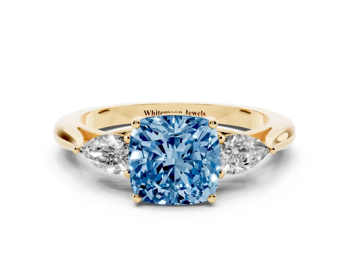 Fancy Blue Three-Stone Cushion Cut Brilliant Diamond Solitaire Ring with Tapered Band and Four-Prong Setting Yellow gold