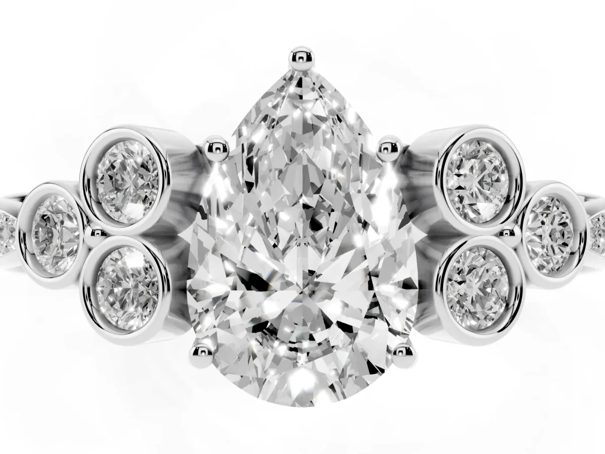 Pear Cut Cut Diamond Engagement Ring with Bezel Set Round Side Stones and Prong Setting Silver