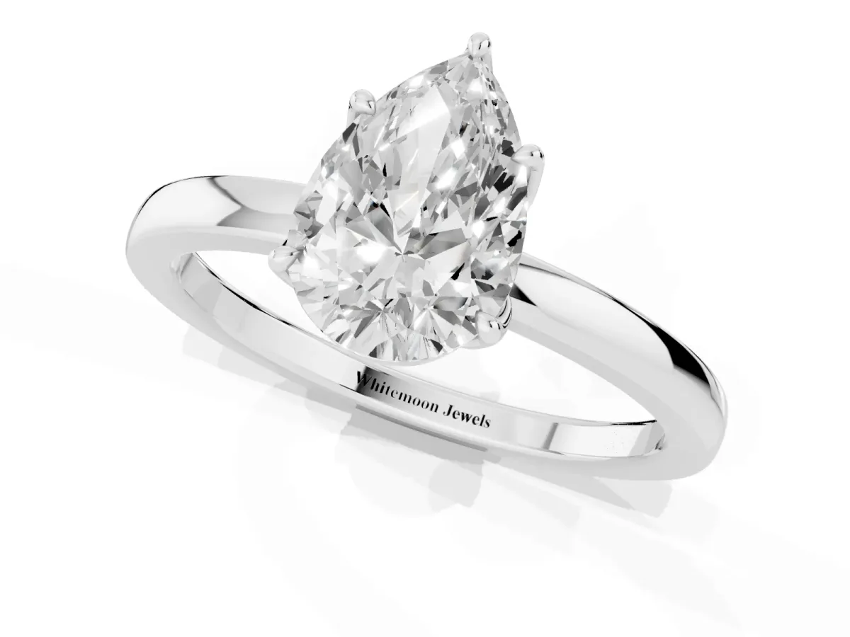 Pear Cut Diamond Solitaire Ring with Thin Band and Prong Setting Platinum