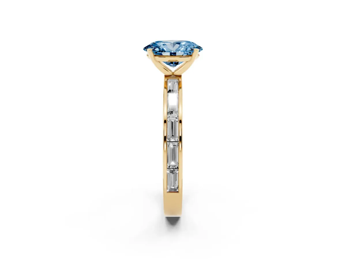 Fancy Blue Oval Cut Solitaire Diamond Ring with Channel-Set Baguette Band and Four-Prong Setting Yellow gold