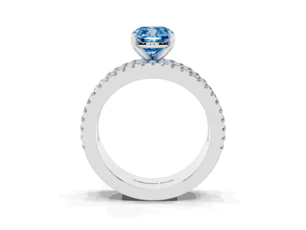 Fancy Blue Cushion Cut Diamond Solitaire Ring with Pavé and Channel Set Band Silver