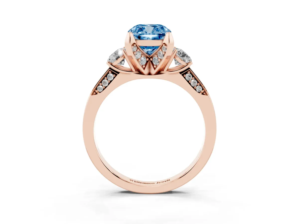 Fancy Blue Cushion Cut Brilliant Three-Stone Diamond Ring with Pavé Band and Four-Prong Setting Rose gold