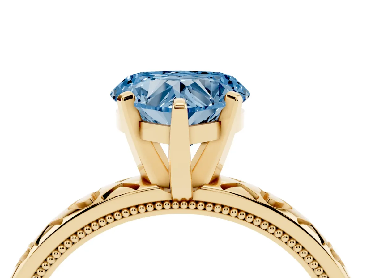 Fancy Blue Heart Cut Solitaire Diamond Engagement Ring with XO Engraved Band and Four-Prong Setting Yellow gold
