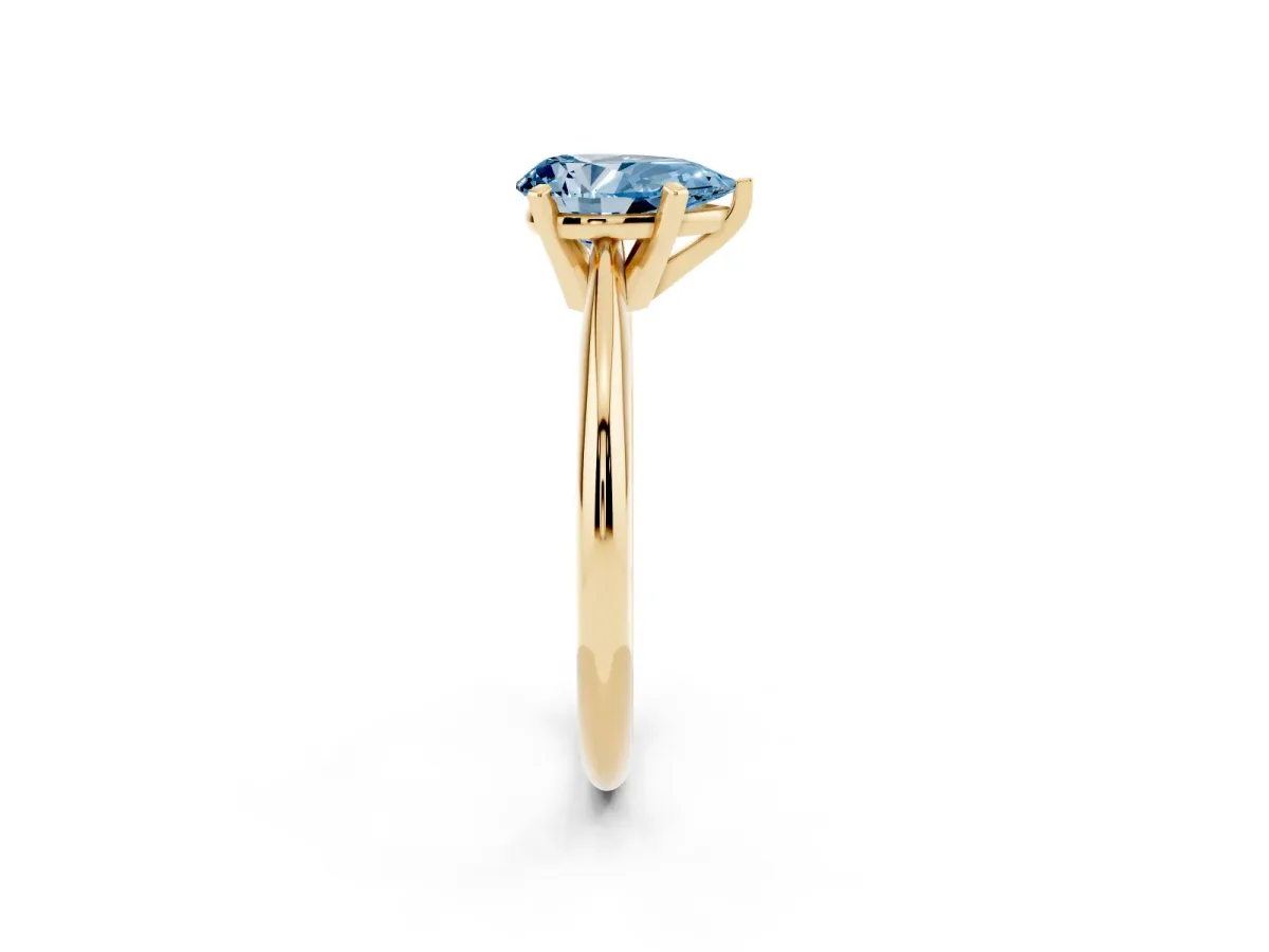 Fancy Blue Pear Cut Cut Solitaire Ring with Four-Prong Setting on a Classic Band Yellow gold