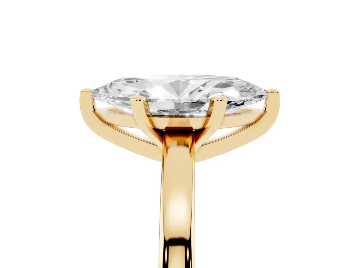 Marquise Cut Solitaire Diamond Engagement Ring with Four-Prong Setting on a Classic Band Yellow gold