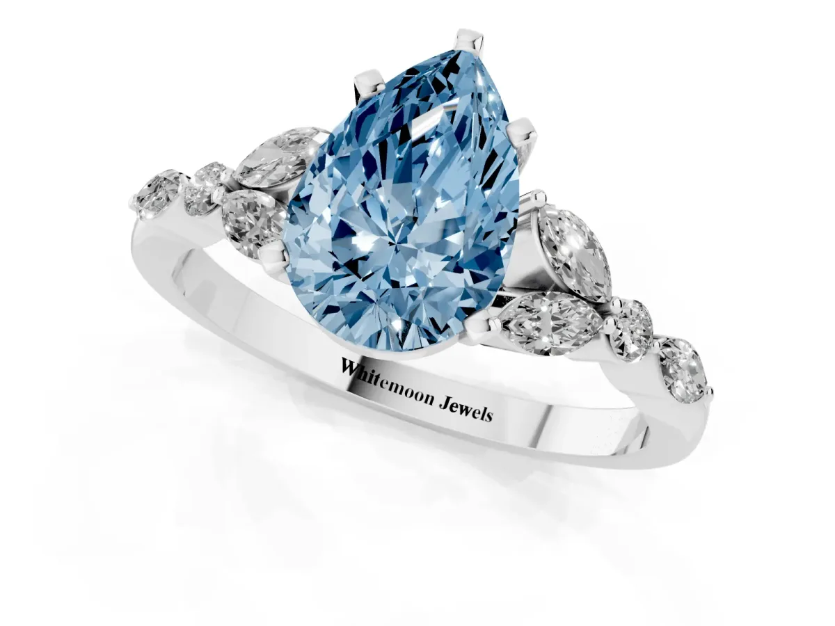 Fancy Blue Pear Cut Diamond Solitaire Ring with Side Stones and Four-Prong Setting Silver