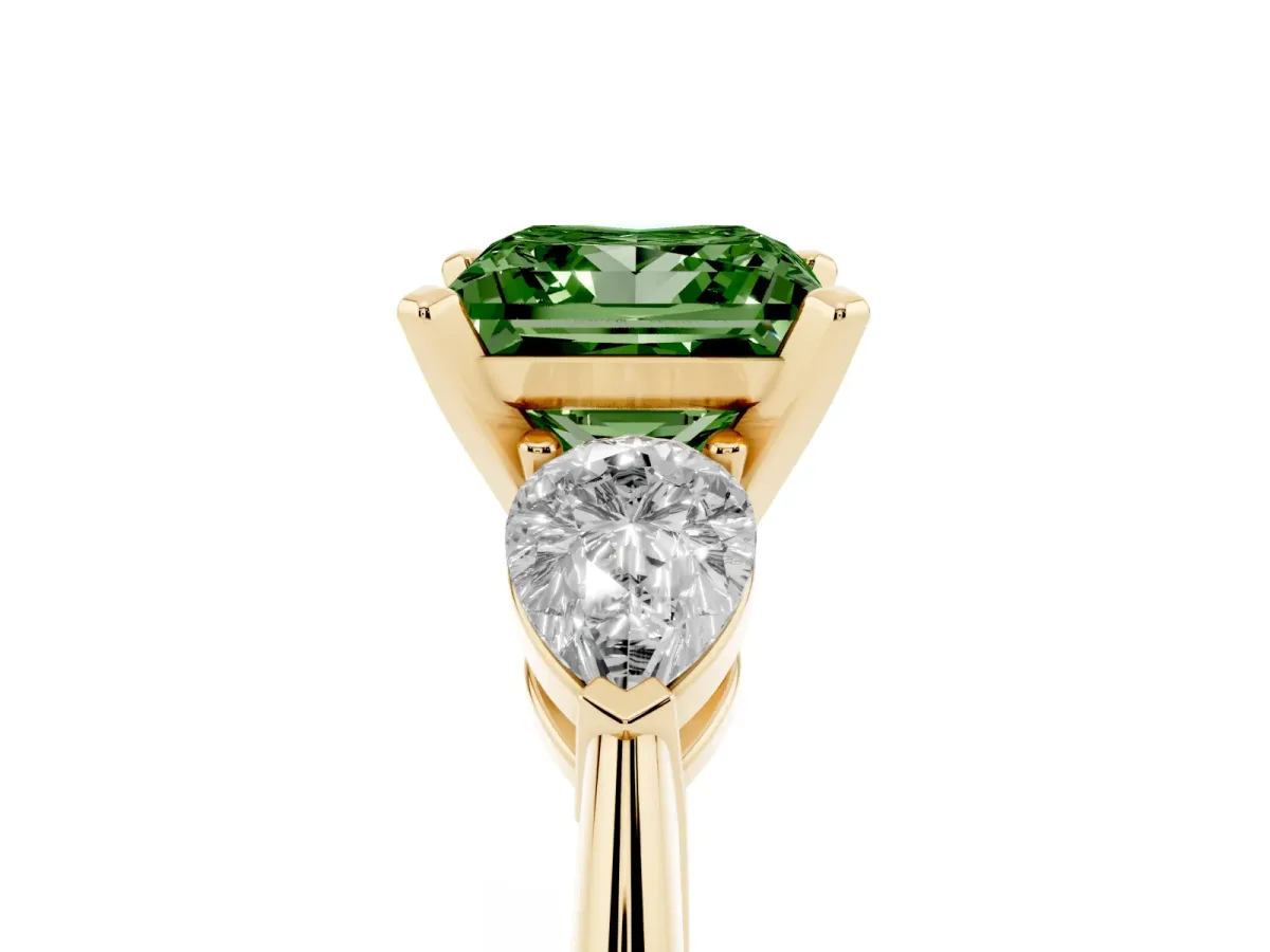 Fancy Green Three-Stone Princess Cut Diamond Ring with Pear Side Stones and Four-Prong Setting Yellow gold
