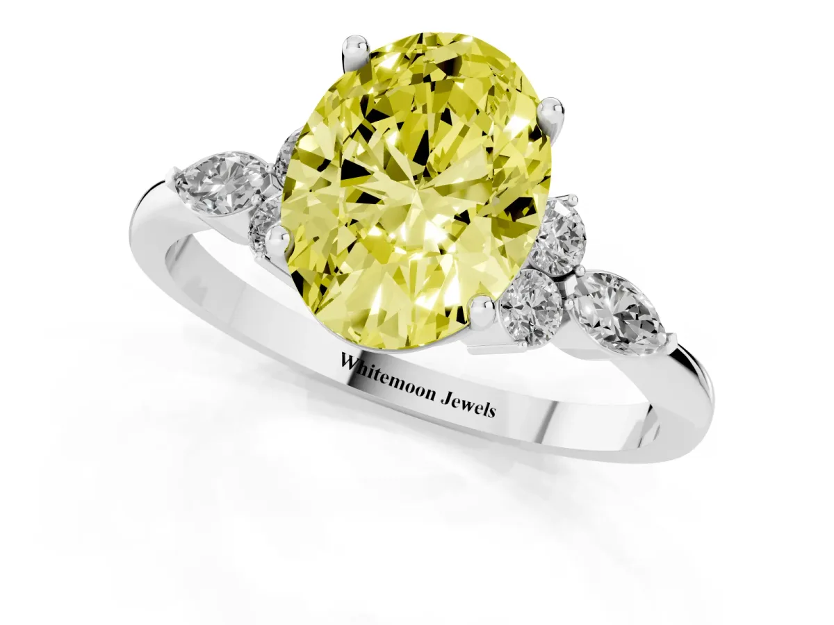 Fancy Yellow Oval Cut Brilliant Diamond Solitaire Ring with Pear Side Stones and Four-Prong Setting White gold