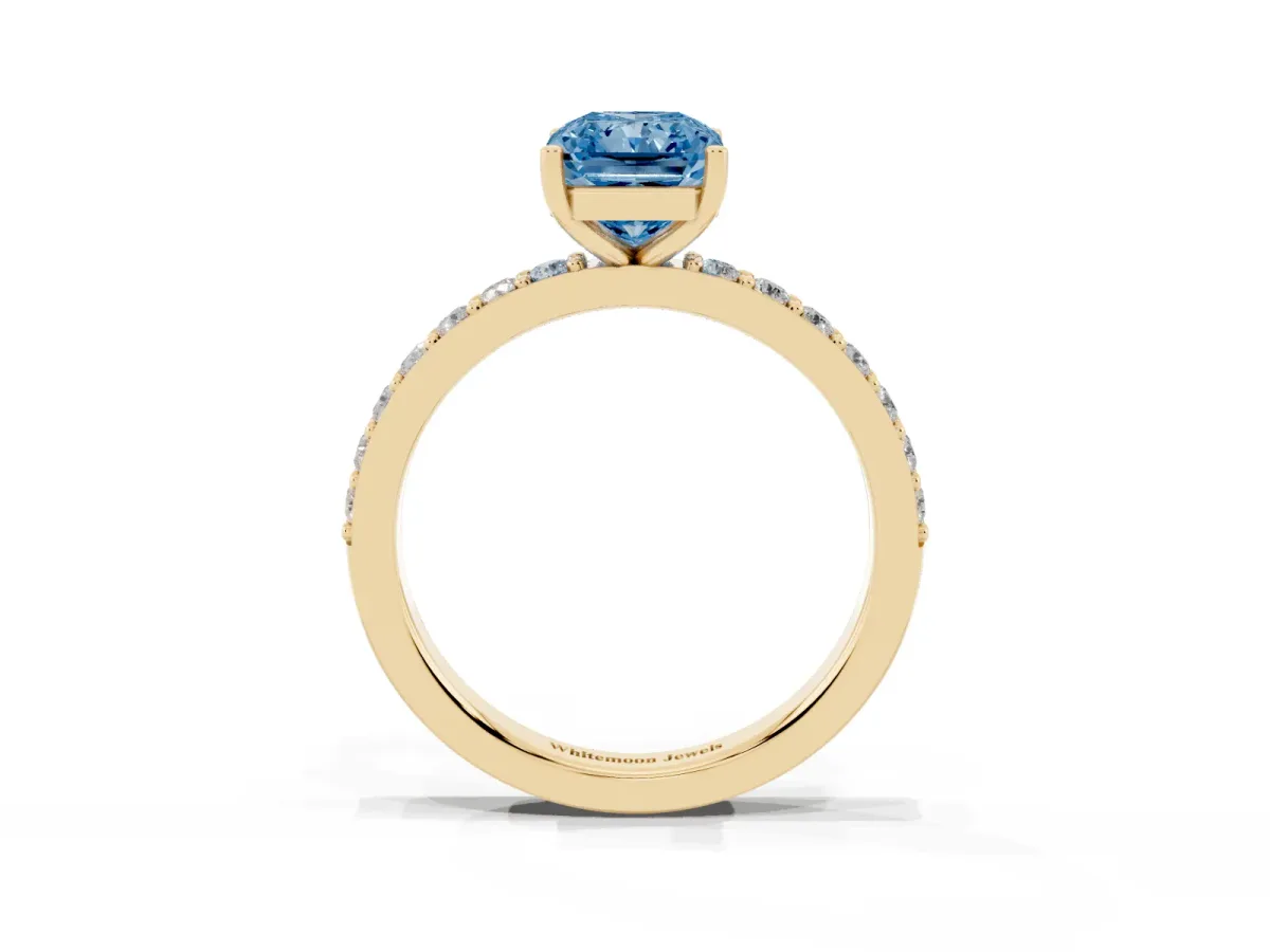 Fancy Blue Radiant Cut Cut Diamond Solitaire with Pave Band and Four-Prong Setting Yellow gold