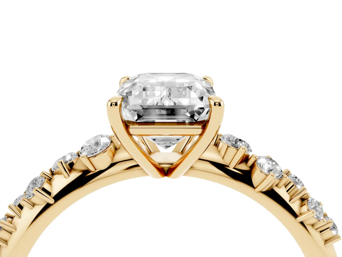 Emerald Cut Diamond Cluster Side Stone Solitaire Ring with Prong Setting Yellow gold