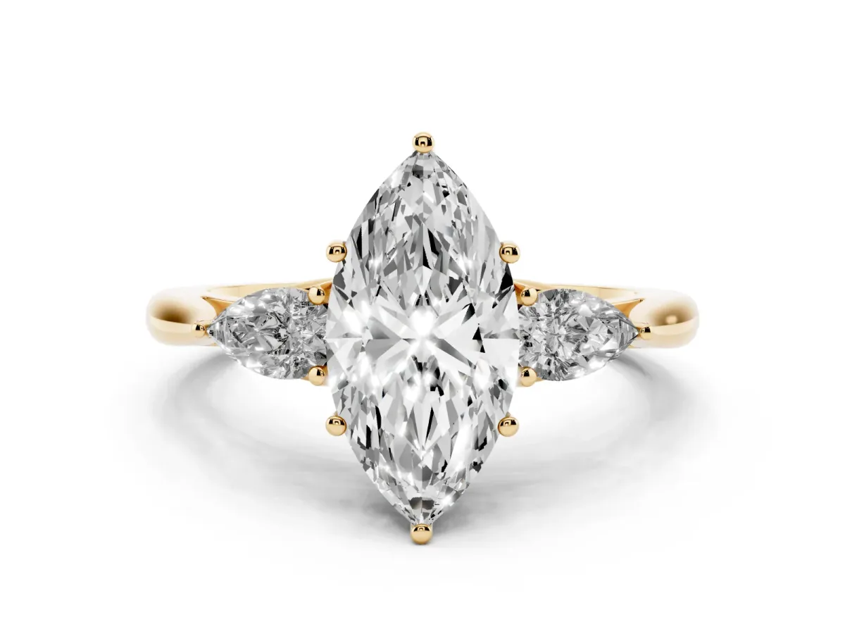 Three-Stone Marquise Cut Diamond Ring with Pear Side Stones in Four-Prong Setting Yellow gold
