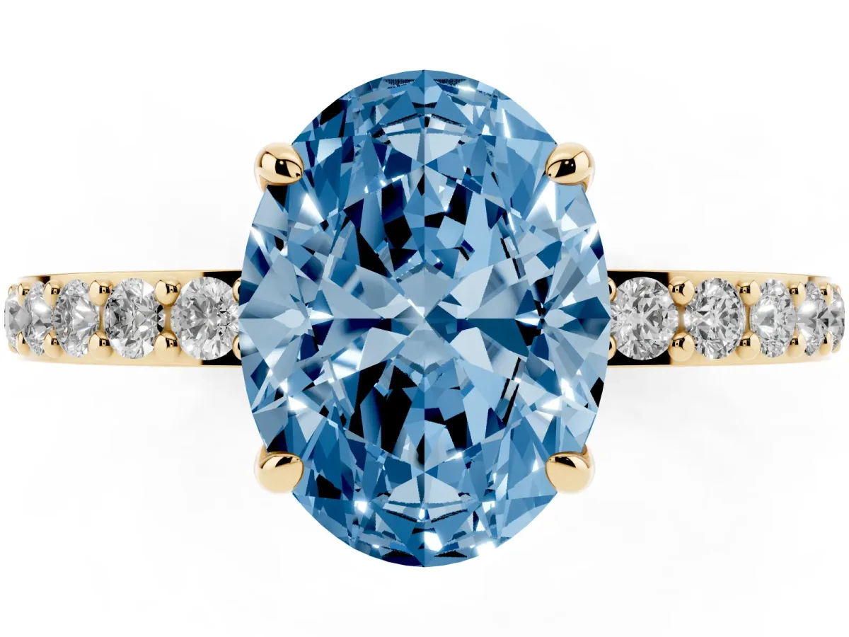 Fancy Blue Oval Cut Diamond Pavé Engagement Ring with Round Accents and Prong Setting Yellow gold