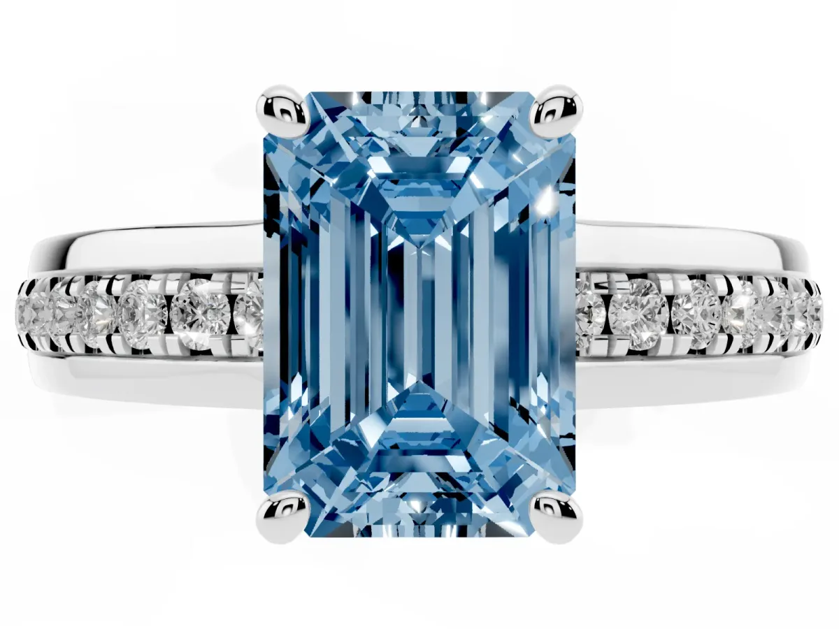 Fancy Blue Emerald Cut Solitaire Diamond Ring with Channel Set Band and Six-Prong Setting Silver