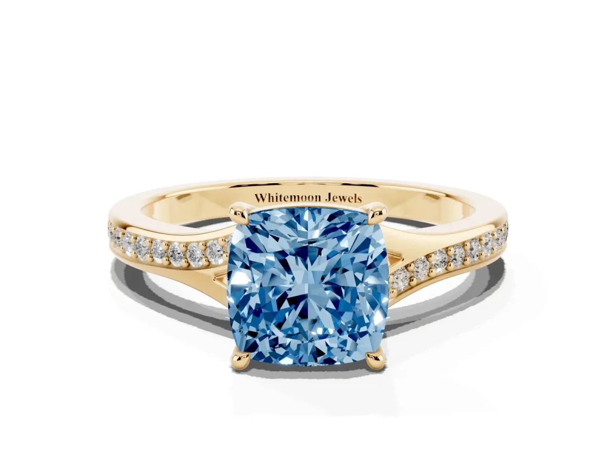 Fancy Blue Cushion Cut Diamond Solitaire Ring with Pavé Band and Prong Setting Yellow gold
