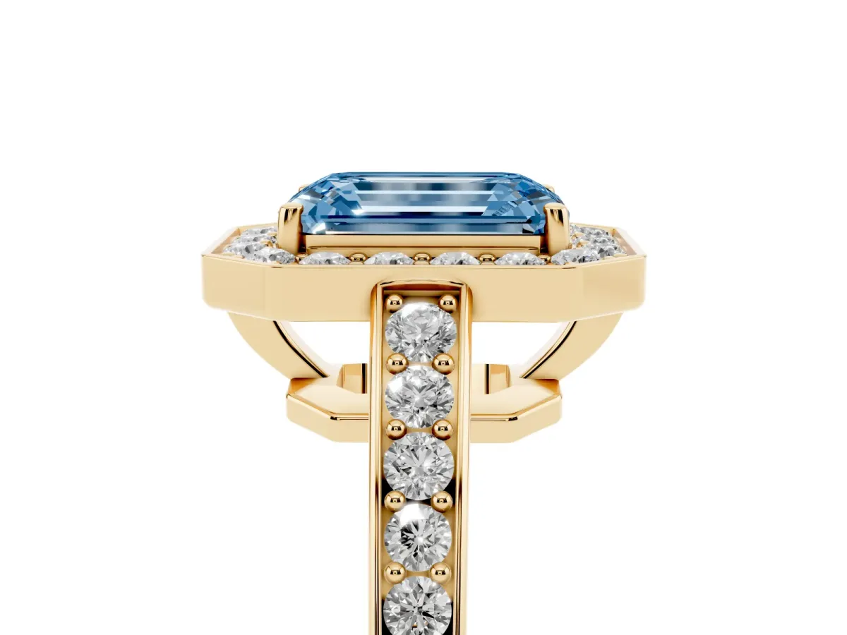 Fancy Blue Emerald Cut Halo Pavé Diamond Engagement Ring with Bezel Setting Yellow gold