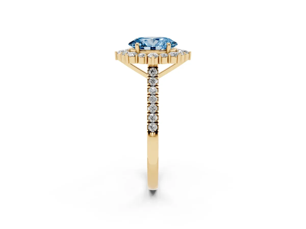 Fancy Blue Oval Cut Halo Diamond Ring with Pavé Band and Prong Setting Yellow gold