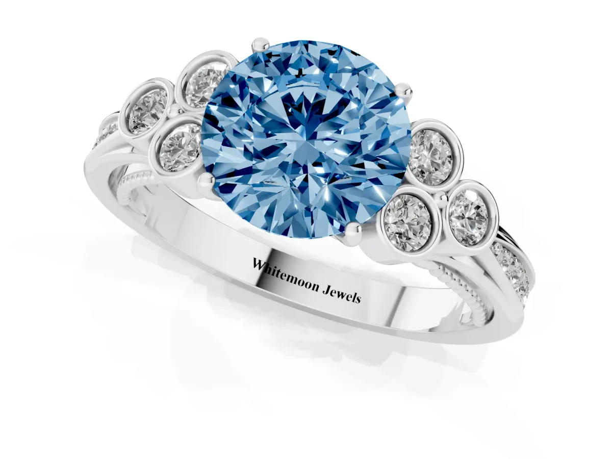 Fancy Blue Round Cut Cut Diamond Engagement Ring with Bezel Set Round Side Stones and Prong Setting Silver