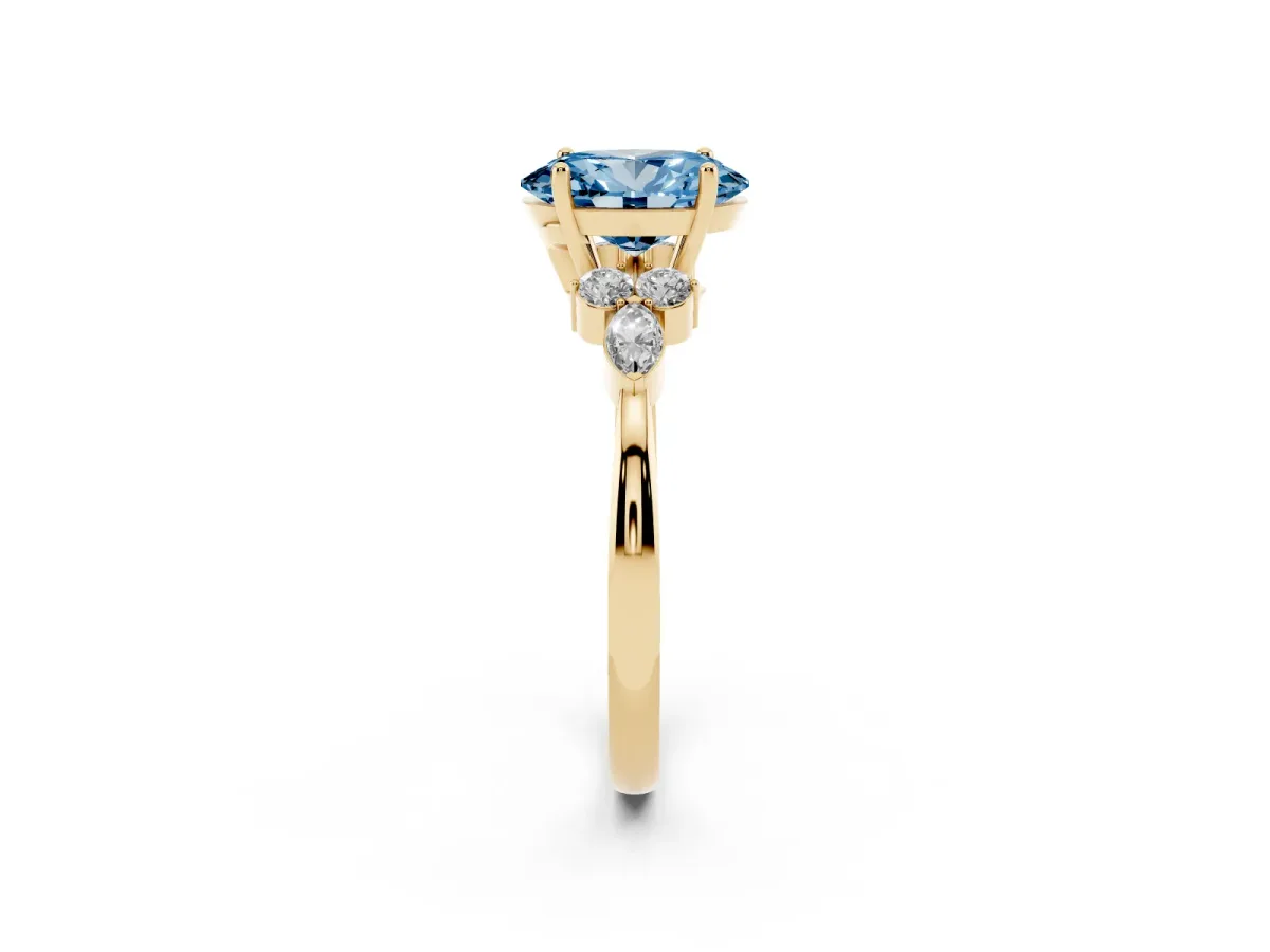 Fancy Blue Oval Cut Brilliant Diamond Solitaire Ring with Pear Side Stones and Four-Prong Setting Yellow gold
