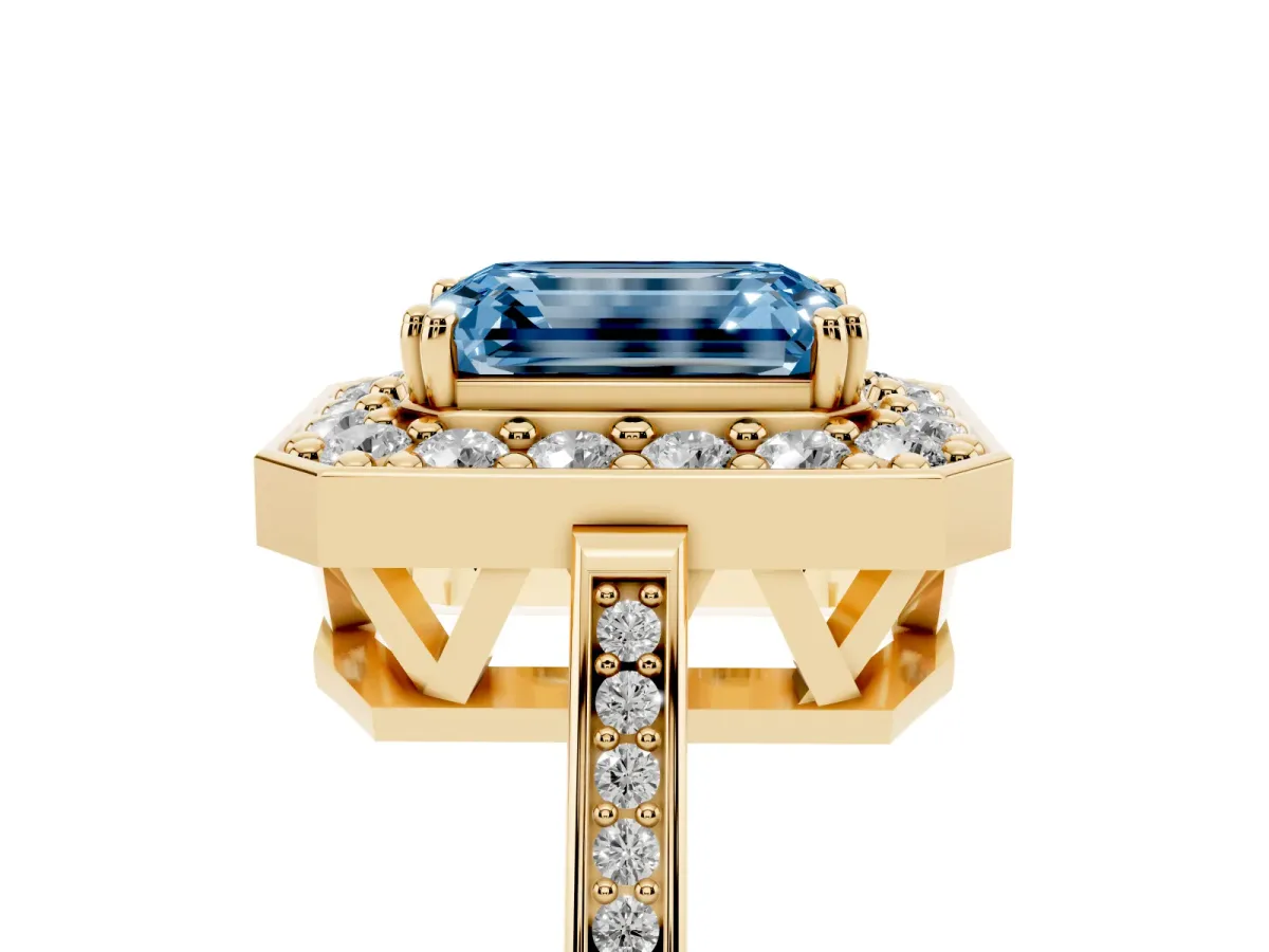 Fancy Blue Emerald Cut Diamond Halo Ring with Split Shank and Four-Prong Setting Yellow gold
