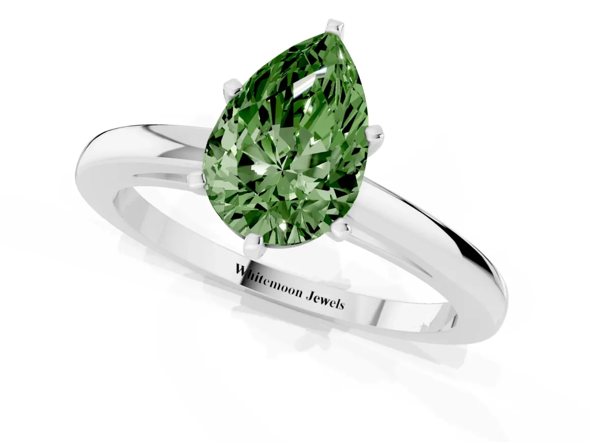 Fancy Green Pear Cut Solitaire Diamond Engagement Ring with Four-Prong Setting on a Classic Band Silver