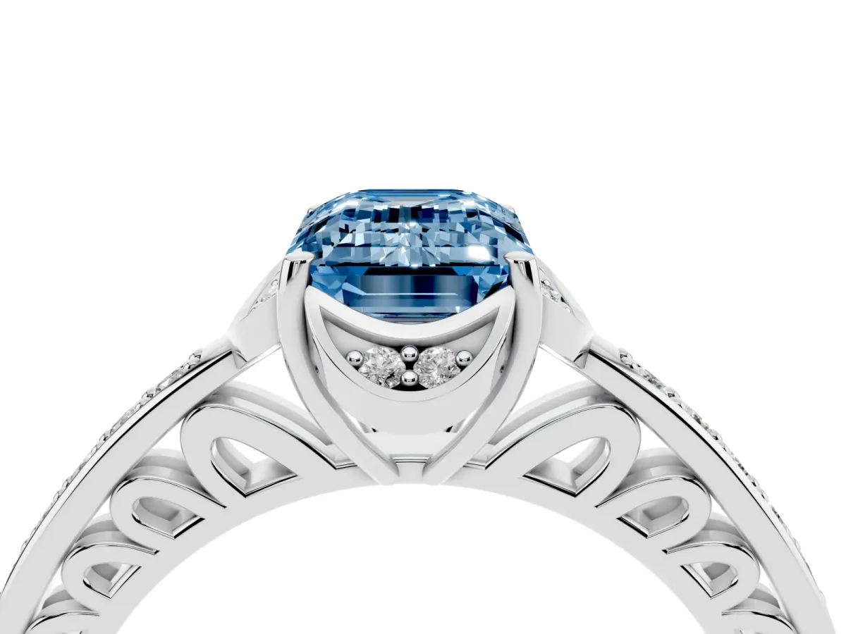 Fancy Blue Emerald Cut Cut Halo Diamond Ring with Channel Set Band and Four-Prong Setting Silver
