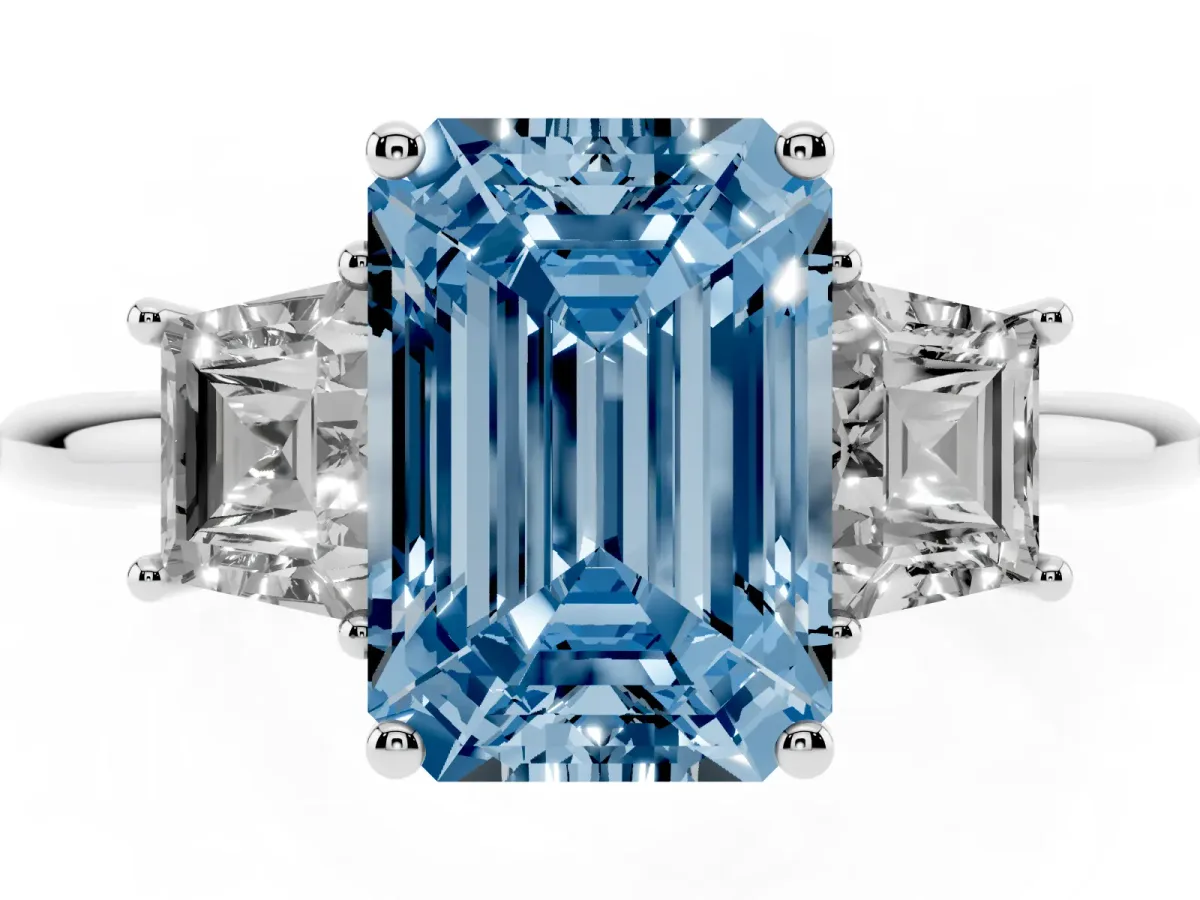 Fancy Blue Emerald Cut Diamond Three-Stone Ring with Trapezoid Side Stones and Prong Setting Platinum