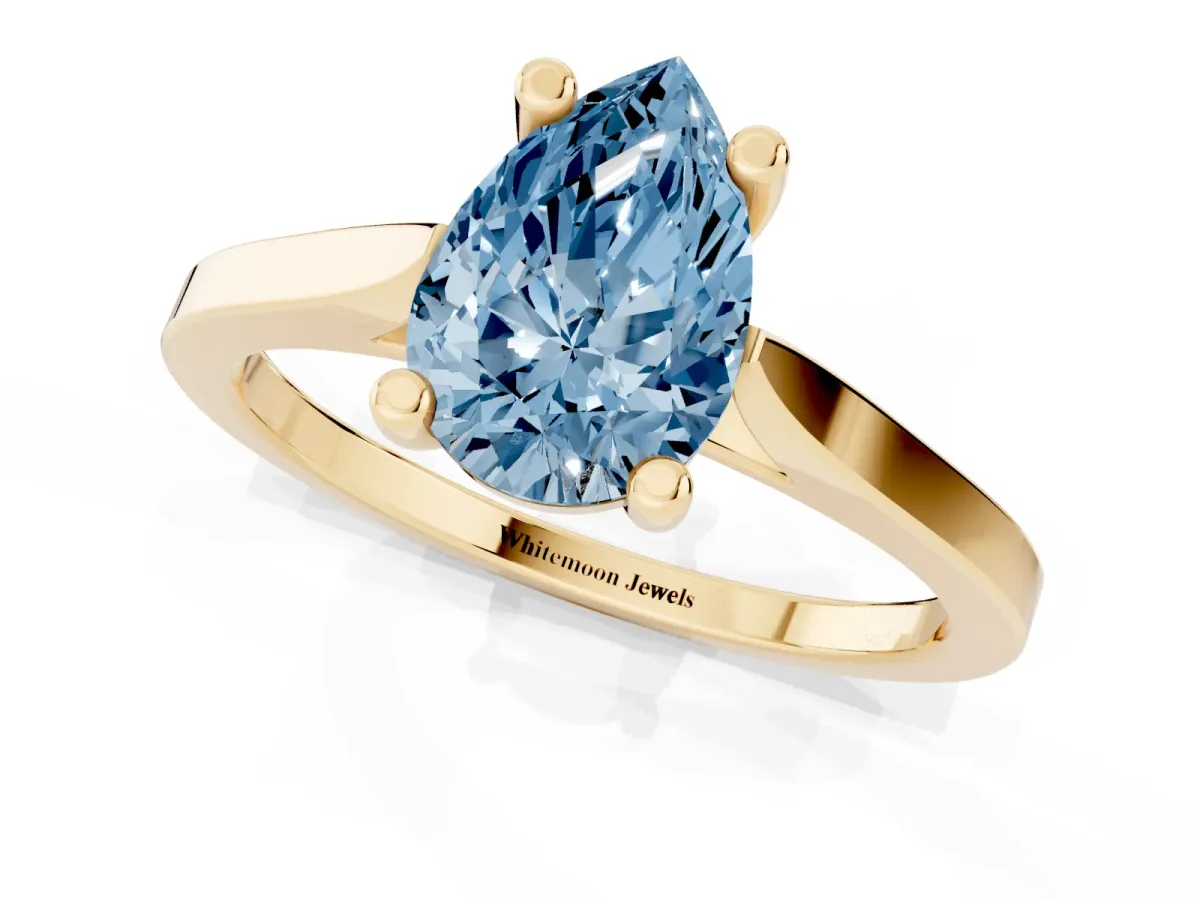 Fancy Blue Pear Cut Solitaire Diamond Ring with Four-Prong Setting and Tapered Band Yellow gold