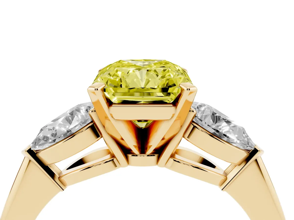 Fancy Yellow Three-Stone Radiant Cut Diamond Ring with Pear Side Stones and Four-Prong Setting Yellow gold