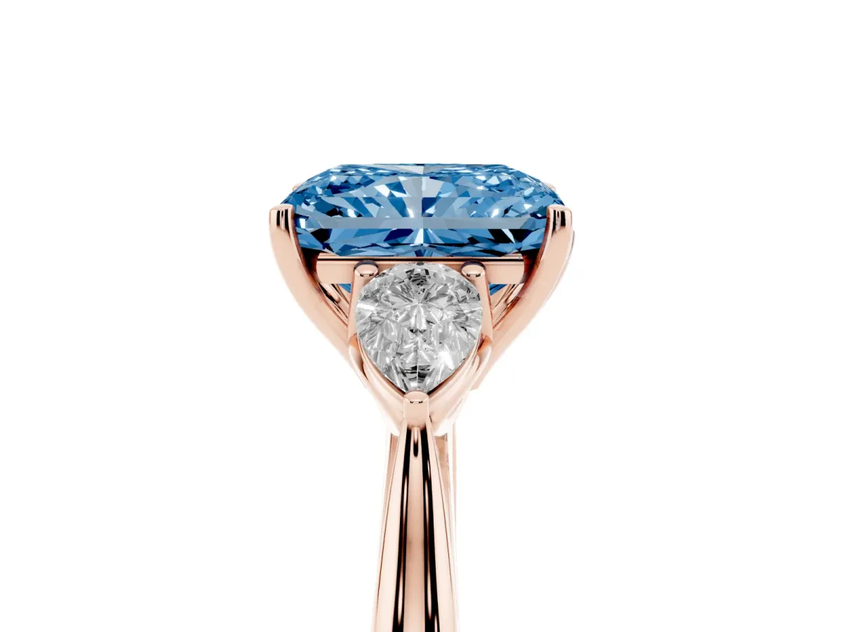 Fancy Blue Three-Stone Radiant Cut Diamond Ring with Pear Side Stones in Four-Prong Setting Rose gold