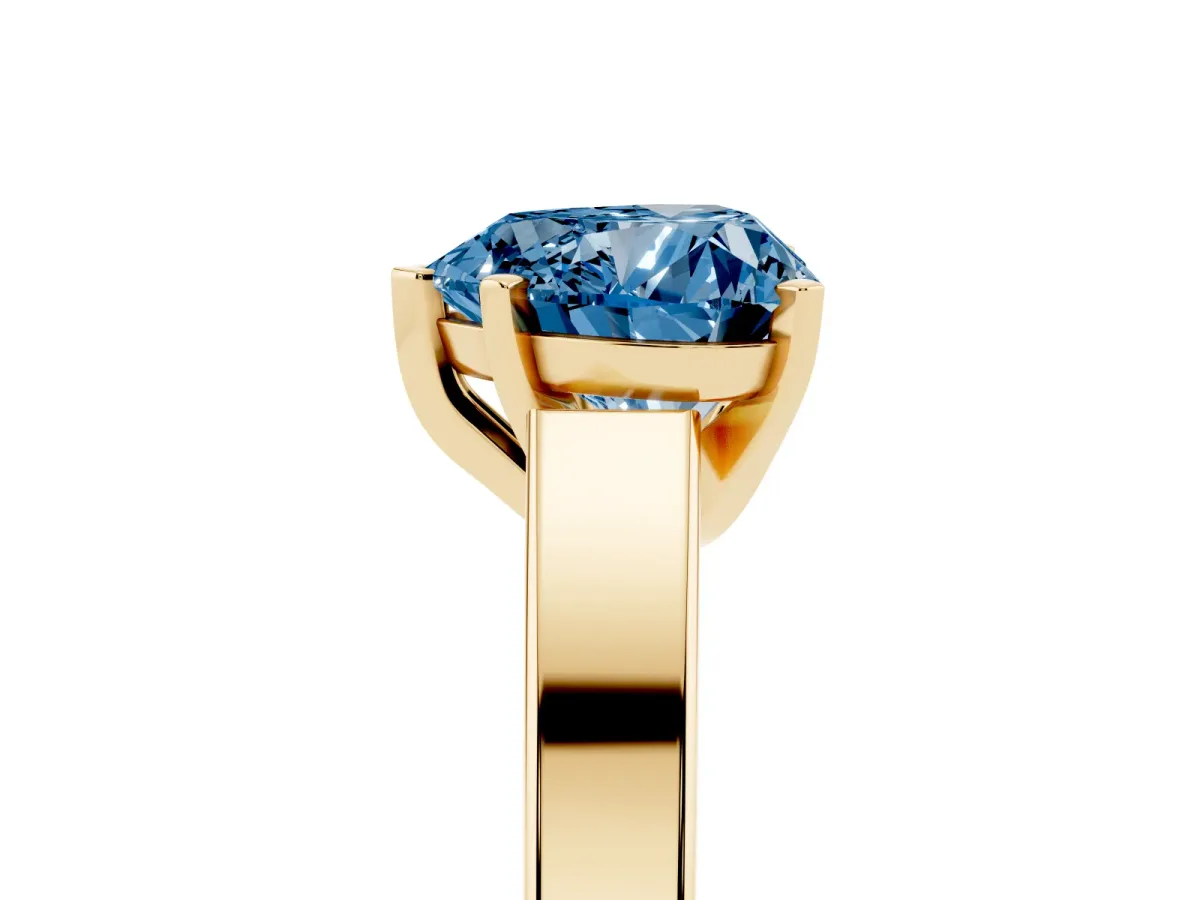 Fancy Blue Heart Cut Solitaire Engagement Ring with Four-Prong Setting and Tapered Band Yellow gold